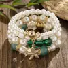 Pulsera Blanca Perla Imitación Multicapa 4 Hilos Estilo Vacaciones en la Playa Estrella de Mar Pulsera de Moda Fuente Transfronteriza Venta al por Mayor