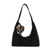 Bolsa feminina grande vintage, nova coleção outono 2026, design casual de nicho, bolsa de ombro e transversal, bolsa de bolinho para o dia a dia