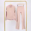Conjunto Lulu Df de Jaqueta com Gola Alta Estampada e Calça Flare com Etiqueta, Em Estoque Envio Direto, Gola Alta Slim Fit, Zíper Dourado Elástico