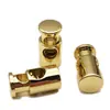 Metal dorado puntual agujero único cuerda de ajuste elástico hebilla Hebilla de resorte de presión hebilla de cabeza de cuerda hardware de galvanoplastia para ropa grano colgante