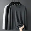 Camiseta de manga larga para hombre, capa interior de otoño para hombre, camiseta base elástica de corte holgado, camiseta estampada estilo coreano ins para hombre