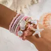Conjunto de pulseiras de férias estilo boêmio transfronteiriço europeu e americano, pulseira multicamadas com sementes, concha e estrela-do-mar