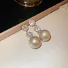 Pendientes de Perla de Circonita de Moda de Aguja Plateada Pendientes de Botón Retro de Lujo Ligero de Nicho Francés Pendientes Nuevos 2026