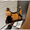 Bolso cubo único con patrón de diamantes para mujer, nuevo otoño 2026, moda vintage de alta gama, para hombro, cruzado y de mano