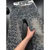 Jeans jacquard de ajuste cómodo con estrellas completas para hombre, pantalones lavados de alta gama para primavera, jeans acampanados estilo americano tie-dye