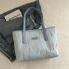 Bolso de mano informal de gran capacidad, a rayas, de moda, estilo nuevo de invierno 2025, elegante y fresco, para llevar al hombro o debajo del brazo, para mujer.