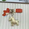 Nuevo Colgante de Pony de Dibujos Animados en Imitación Oro, Pinza para Teléfono en Forma de Cuchara, Colgante para Bolso, Estilo Minimalista Moderno Personalizado
