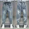 Jeans Harem Masculino de Cintura Elástica Solta Estilo Primavera e Outono Calças Masculinas Retrô Versátil Lavado Slim Casual para Homens