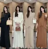 Elegante atuendo de otoño para mujer: un conjunto de dos piezas nuevo, chic y de corte holgado que presenta un top de punto con manga murciélago y una falda midi plisada