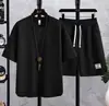Nuevo traje deportivo casual para hombre, nuevo conjunto de dos piezas de camiseta de manga corta holgada de seda helada y pantalones cortos para hombre