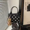 Moda fuente de fábrica transfronteriza 2026 nuevo diseño de lunares en nailon bolso de mano casual para el día a día bolso de hombro tipo cubo