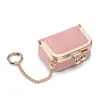 Popular bolsa compacta de cuero genuino para joyería transfronteriza para anillos, collares, pendientes y accesorios, monedero mini multifuncional