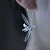 Nuevos aretes de perla y orquídea estilo chino, elegantes y refinados, con artesanía de perlas y un diseño floral fresco