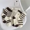 Calcetines Zhuji, calcetines de otoño e invierno de media pantorrilla para mujer, estilo japonés, calcetines altos a rayas recomendados, calcetines largos transpirables y absorbentes de sudor, venta al por mayor
