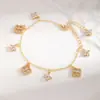 Nova Pulseira de Trevo de Quatro Folhas com Zircônia Incrustada em Cobre para Mulheres Design de Nicho de Luxo Leve Pulseira de Trevo Totalmente Diamantada Vendedor de Sucesso Transfronteiriço