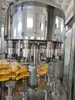 Suministro de Fabricantes Máquina Llenadora Tres en Uno de Bebida Gaseosa Botella de Vidrio Máquina Llenadora de Cerveza Máquina Llenadora de Bebidas Carbonatadas