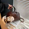 Bolsa de Mão Boston Feminina 2026 Nova Outono Popular Moda Simples Bolsa de Ombro Transversal Bolsa Almofada