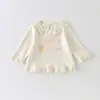 Camiseta Básica Tendência e Versátil para Bebês e Crianças Pequenas, Novo Estilo Primavera 2026, Camiseta de Manga Longa Estampada com Acabamento em Renda para Bebês Meninas, Classe a