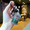 Tendência no TikTok Garrafa de Refrigerante Contas Coloridas Chaveiro Luminoso Preenchido com Óleo Puxador Fácil Lata Areia Líquida Pequeno Pingente Brinquedo Presente Ornamento