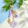 Llavero de Flor de Hilo de Colores con Cuentas Flor Azul Fresca Ramas y Hojas de Rosa Llavero de Metal Encanto de Bolso Suave y Femenino
