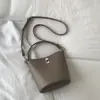 Bolsos Pequeños de Alta Gama de Moda para Mujer Este Año 2026 Nuevo Versátil Retro Hombro Cruzado Bolso Madre-Hija Bolso Cubo Moda