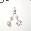 Nuevo llavero colgante acrílico hueco de estrella de cinco puntas con brillo para coche, accesorio de campana bicolor crema, accesorios para bolso