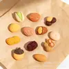 Brinquedos de comida simulada nozes pistaches amendoins castanhas cola de creme DIY acessórios de resina Correntes de celular para Crocs adesivos