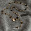 Collar con colgante de ojo de tigre y bola de hoja de circón, cadena de lana Maillard de moda vintage, cadena de cuello ligera de lujo para otoño e invierno.