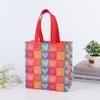 Boda Día de San Valentín Bolso de mano de tela no tejida Embalaje de regalo Tanabata Bolsa de regalo Bolso de mano de tela no tejida recubierto de película transfronterizo
