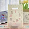 Bolsas de mano perforadas de alta gama transfronterizas, bolsas de regalo de alto valor, recuerdos para tiendas de ropa, bolsas de embalaje para repostería en stock
