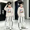 Camiseta de manga larga a rayas estampada de algodón puro para niños, nuevo estilo primavera y otoño, top elegante holgado para niños mayores