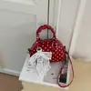 Bolso de mano de lunares estilo coreano transfronterizo, nuevo bolso versátil de moda otoño 2026, bolso de hombro y cruzado de gran capacidad
