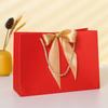 Bolsa de papel para ropa, bolsa de regalo con lazo, bolsa de compras, bolsa de embalaje de color sólido, logotipo imprimible, venta al por mayor
