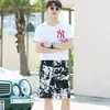 Shorts JX Masculino Verão Algodão Seda Feminino Calça de Praia Casal Secagem Rápida Solta Casual Shorts de Surfe Tendência Masculina Calça de Cinco Pontos