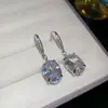 Conjunto de brincos e anel ovais com zircônia da moda, apresentando uma delicada corrente para clavícula com um design luxuoso e sofisticado, uma coleção de joias única e refinada