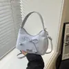 Bolso de mano ligero estilo coreano para mujer, nueva colección 2026, con diseño de lazo, chic, versátil, moderno y dulce, disponible como bolso de hombro o bolso cruzado, al por mayor
