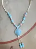 Collar con colgante de campana de mariposa de cerámica de estilo étnico retro para mujer, diseño nuevo y moderno, cadena larga para suéter, accesorios
