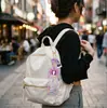 Agitador de arena líquida acrílico colgante de apoyo a celebridades personalizado, decoración de mochila de dibujos animados personalizada, fabricante directo, lotes pequeños