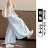 Culottes amarillos estilo perezoso con forma de capullo de flor para mujer Verano 2025 Nuevo casual de cintura alta pequeño holgado linterna pierna ancha