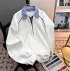 Moletom com Capuz Patchwork Falso de Duas Peças com Lapela Masculino Primavera e Outono Novo Estilo Solto Casual Manga Longa Pulôver Marca Tendência Peça Versátil para Usar por Cima
