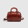 Bolsa Travesseiro Retrô para Mulheres 2026 Nova Bolsa Cilíndrica de Nicho Versátil Bolsa Travesseiro Texturizada Fashion Bolsa de Mão Transversal