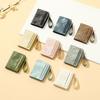 Cartera corta transfronteriza para mujer Yue Qian Kai moda ins color de contraste 20% de descuento pulsera de mano billetera multi-tarjeta al por mayor