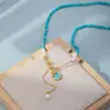 Nuevo Collar Turquesa Estilo Chino con Acabado de Alta Gama, Colgante de Flor de Rosa y Perla, Cadena Clavicular Retro Estilo Nacional de Lujo Ligero de Nicho para Mujer
