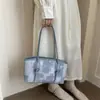 Tendência transfronteiriça mulheres que se deslocam 2026 nova bolsa de ombro única popular retrô textura casual versátil bolsa tote