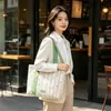 Bolso de lona nuevo con rayas florales, fresco y elegante, gran capacidad, adecuado para estudiantes, versátil para ir al trabajo, bolso de hombro