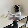 Bolso de mano con lazo de verano 2026 transfronterizo, bolso de hombro moderno y simple para el trabajo, bolso personalizado para el antebrazo