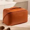 Nuevo Producto 2026 Bolsa de Maquillaje de Almohada de Cuero Bolsa de Almacenamiento Portátil para Viajes Gran Capacidad Bolsa de Artículos de Tocador con Compartimentos Venta al por Mayor de Fábrica