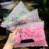 Versión coreana de linda bolsa autosellada para accesorios para el cabello, bolsa de almacenamiento para mascarillas, bolsa de embalaje con cremallera, bolsa de almacenamiento portátil de viaje, venta al por mayor