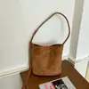 Bolso cruzado de gamuza retro versátil, simple y elegante, adecuado para ir al trabajo, estilo bolso cubo, moda coreana, bolso de axila de moda
