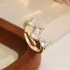 Moda Transfronteriza Europea y Americana Anillo de Cobre Chapado en Oro con Circonita de Colores Estilo Frío Lazo Nudo Tendencia Temperamento Anillo de Dedo Abierto Ajustable